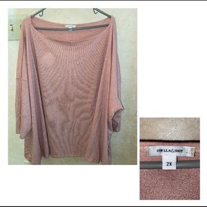 Plus size blush colored oversized long sleeve shirt.